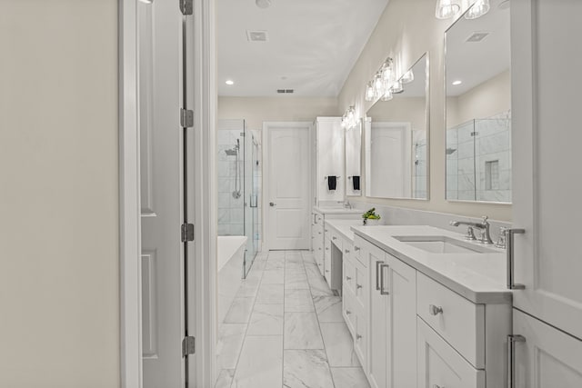 bathroom featuring vanity and separate shower and tub