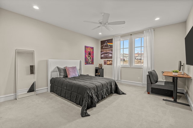 bedroom featuring ceiling fan and light colored carpet