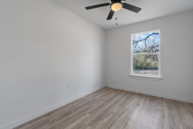 unfurnished room with ceiling fan, a healthy amount of sunlight, and light hardwood / wood-style flooring