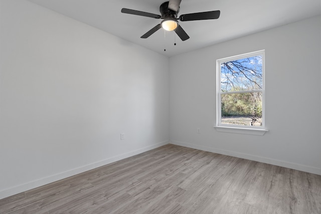 unfurnished room with ceiling fan and light hardwood / wood-style floors