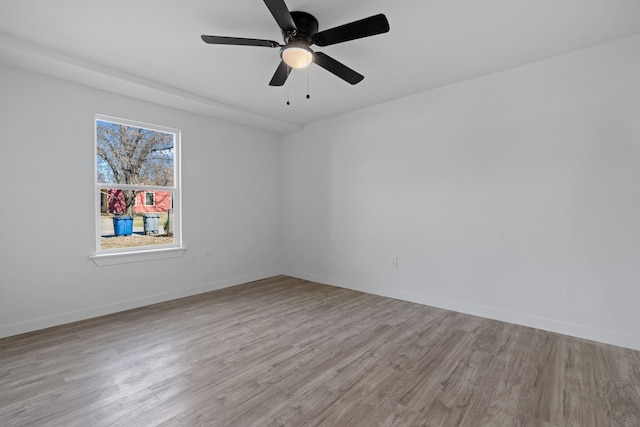 spare room featuring ceiling fan and light wood-type flooring