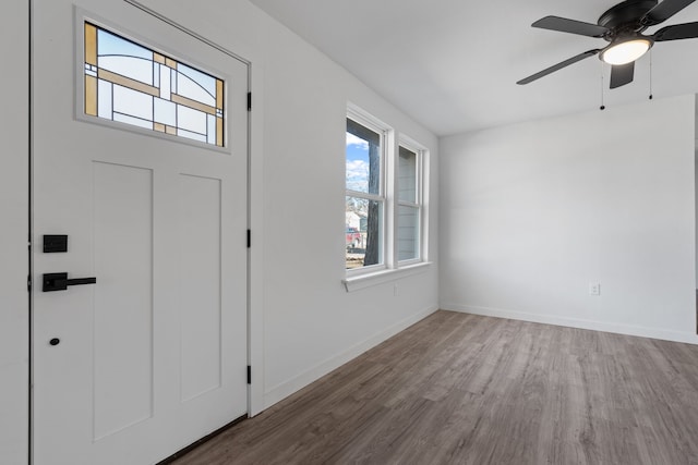 entryway featuring wood-type flooring and ceiling fan