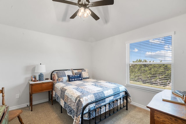 bedroom featuring ceiling fan and light carpet