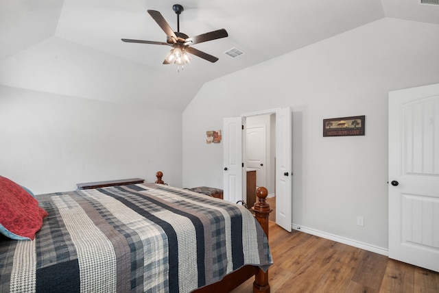 bedroom featuring ceiling fan, vaulted ceiling, and light hardwood / wood-style flooring