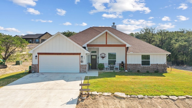 view of front of house with a garage and a front lawn