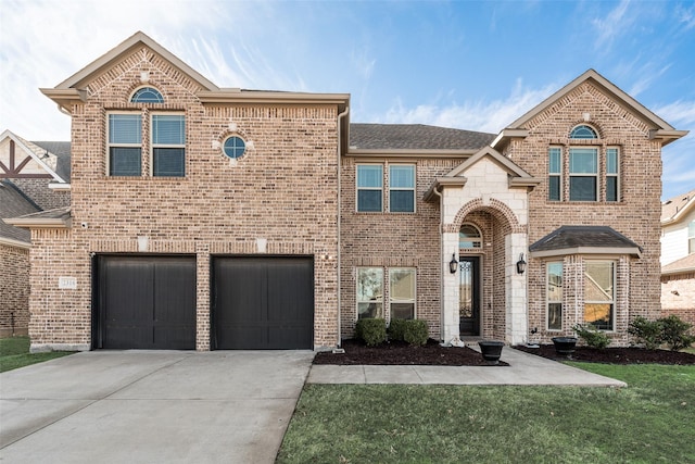 view of front facade with a front lawn and a garage