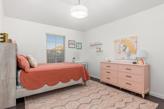 bedroom with hardwood / wood-style flooring