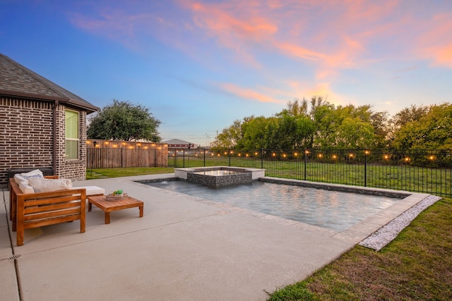 patio terrace at dusk with an outdoor hangout area and an in ground hot tub