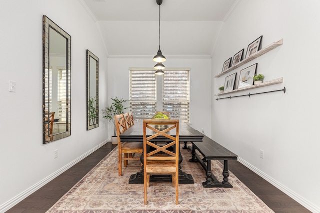 dining room with lofted ceiling and wood-type flooring