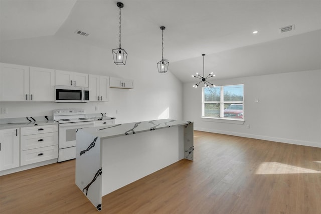 kitchen with white cabinetry, white electric stove, and hanging light fixtures