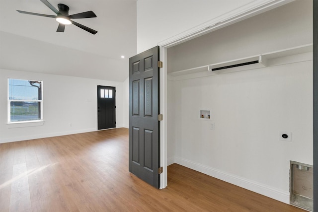 laundry room with washer hookup, plenty of natural light, wood-type flooring, and electric dryer hookup