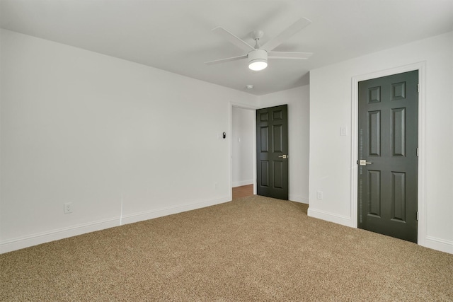 unfurnished bedroom featuring ceiling fan and carpet floors