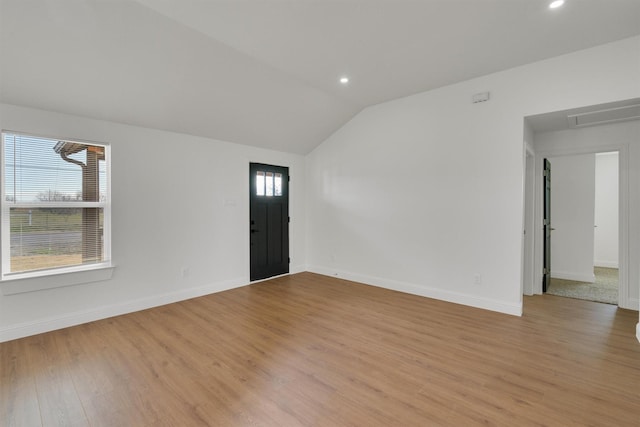 12069 Fm 1392, Terrell, TX 75160 - empty room featuring recessed lighting, vaulted ceiling, light wood-style flooring, and baseboards