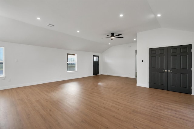 12069 Fm 1392, Terrell, TX 75160 - unfurnished living room featuring vaulted ceiling, a ceiling fan, light wood finished floors, baseboards, and recessed lighting