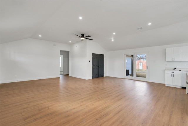 12069 Fm 1392, Terrell, TX 75160 - unfurnished living room with vaulted ceiling, ceiling fan, recessed lighting, light wood-style flooring, and baseboards