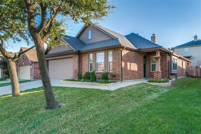 view of front of home with a garage and a front yard