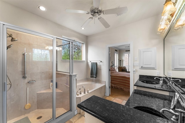 bathroom featuring separate shower and tub, a healthy amount of sunlight, tile patterned flooring, and vanity