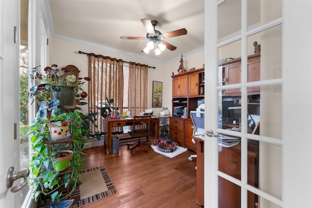 office space with hardwood / wood-style flooring, crown molding, and ceiling fan