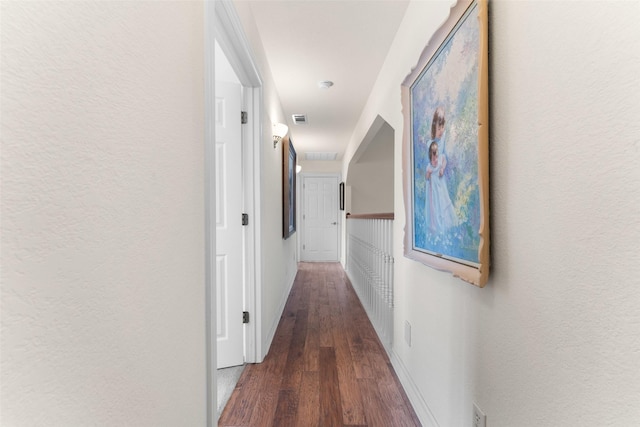 hall with dark hardwood / wood-style floors