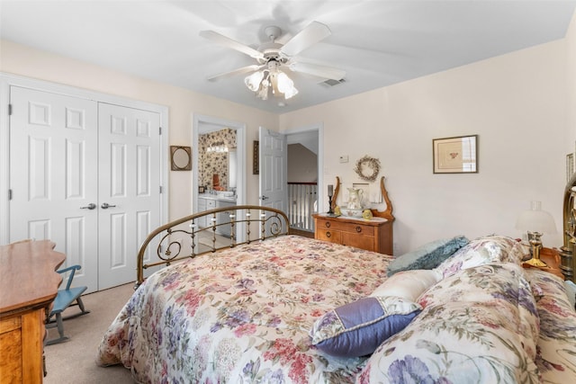 carpeted bedroom with ceiling fan and a closet