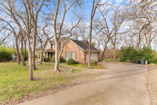 view of front facade with a front lawn and a garage