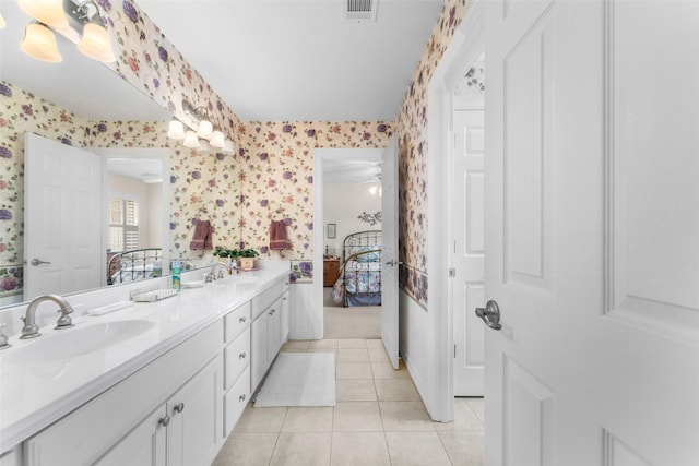 bathroom featuring ceiling fan, tile patterned floors, and vanity