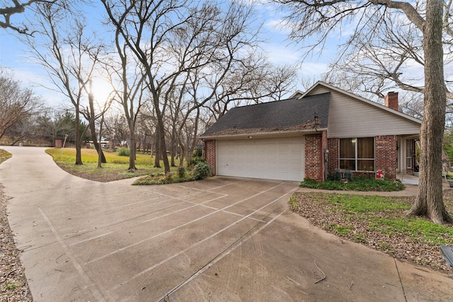 view of side of property featuring a garage