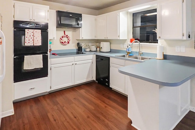 kitchen featuring black appliances, dark hardwood / wood-style floors, sink, and white cabinetry