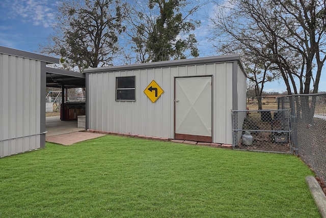 view of outdoor structure featuring a lawn