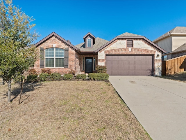 view of front of house with a front lawn and a garage