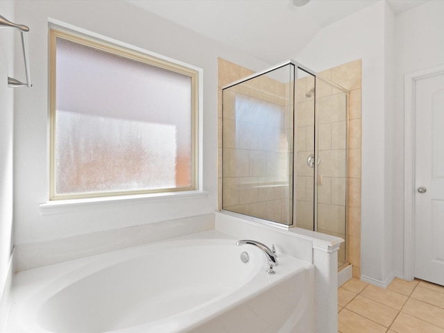 bathroom featuring tile patterned floors and shower with separate bathtub