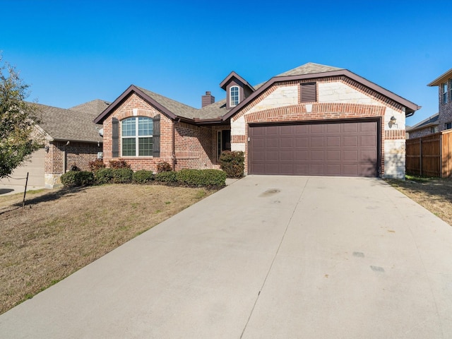 ranch-style house featuring a garage and a front yard