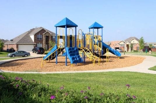 view of playground with a yard