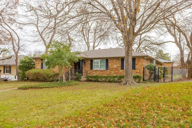 ranch-style home with a front yard