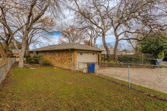 view of side of property with a lawn