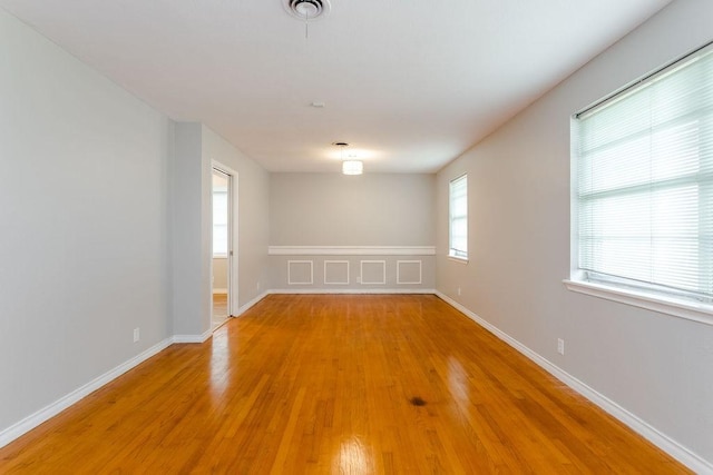 spare room featuring light wood-type flooring