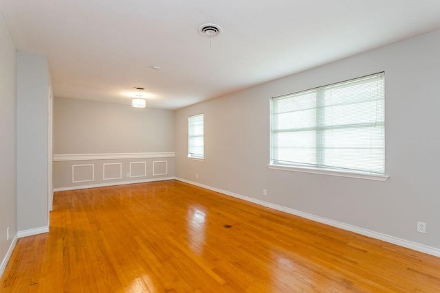 empty room featuring hardwood / wood-style floors