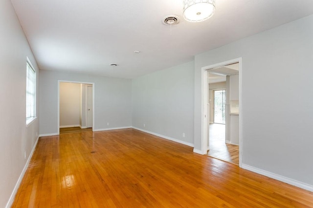 spare room featuring light hardwood / wood-style flooring