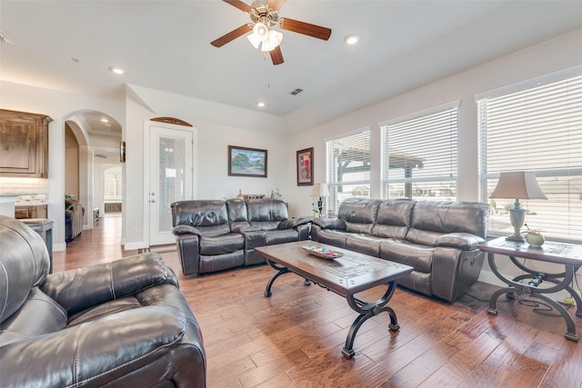 living room with ceiling fan and hardwood / wood-style floors