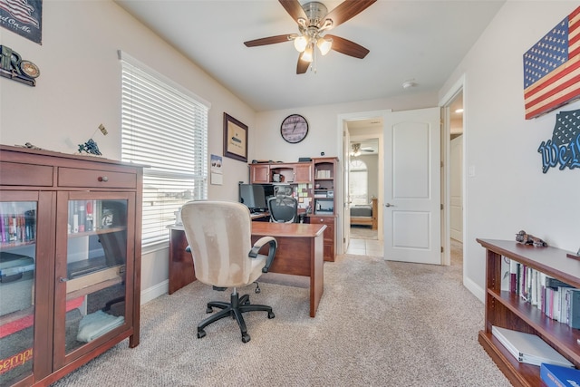 office featuring light carpet and ceiling fan