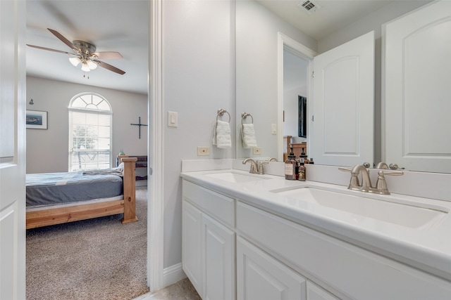 bathroom featuring ceiling fan and vanity