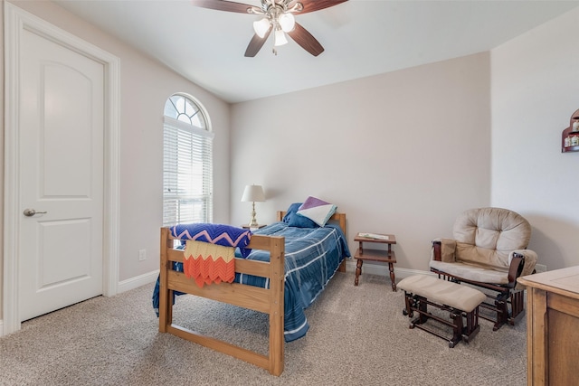 bedroom featuring light carpet and ceiling fan