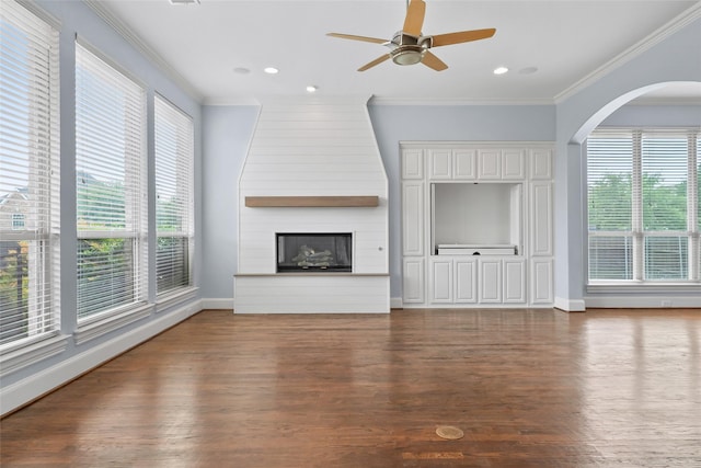 10918 Alta Vista Dr, Frisco, TX 75033 - unfurnished living room featuring plenty of natural light, wood finished floors, and ornamental molding