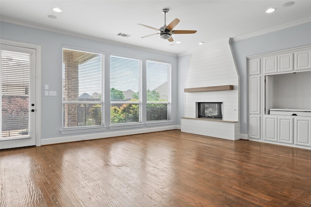 10918 Alta Vista Dr, Frisco, TX 75033 - unfurnished living room featuring a ceiling fan, ornamental molding, visible vents, and wood finished floors
