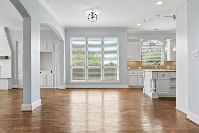10918 Alta Vista Dr, Frisco, TX 75033 - interior space with a sink, recessed lighting, dark wood finished floors, crown molding, and baseboards