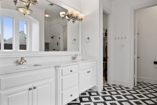 bathroom featuring walk in shower, vanity, tile patterned flooring, a notable chandelier, and ornamental molding