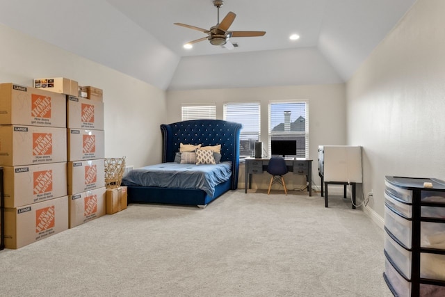 carpeted bedroom featuring ceiling fan and vaulted ceiling