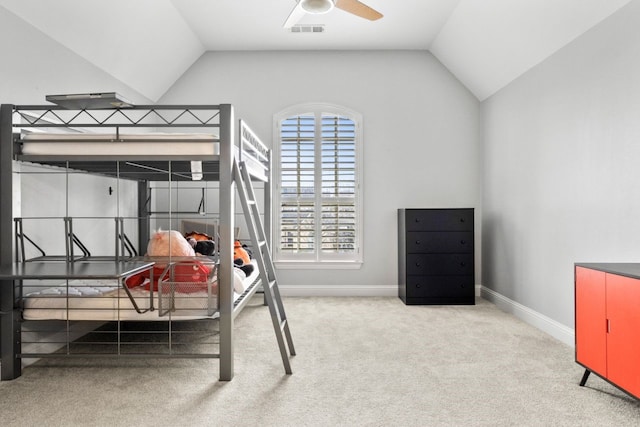 bedroom featuring light colored carpet and vaulted ceiling