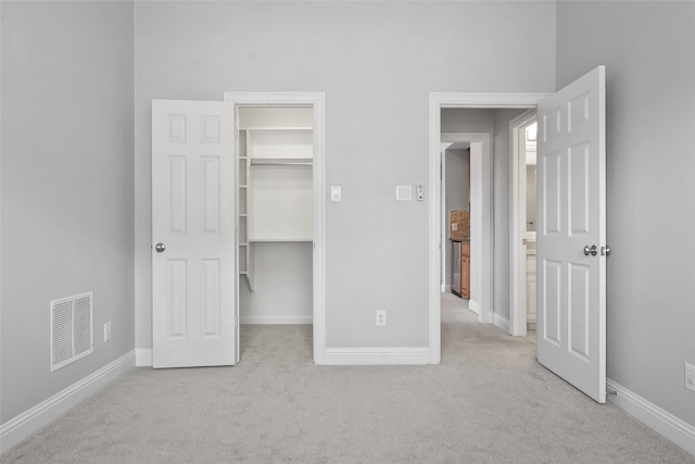 10918 Alta Vista Dr, Frisco, TX 75033 - unfurnished bedroom with a walk in closet, carpet floors, baseboards, and visible vents