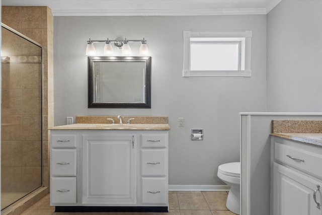 bathroom with an enclosed shower, vanity, tile patterned floors, and toilet